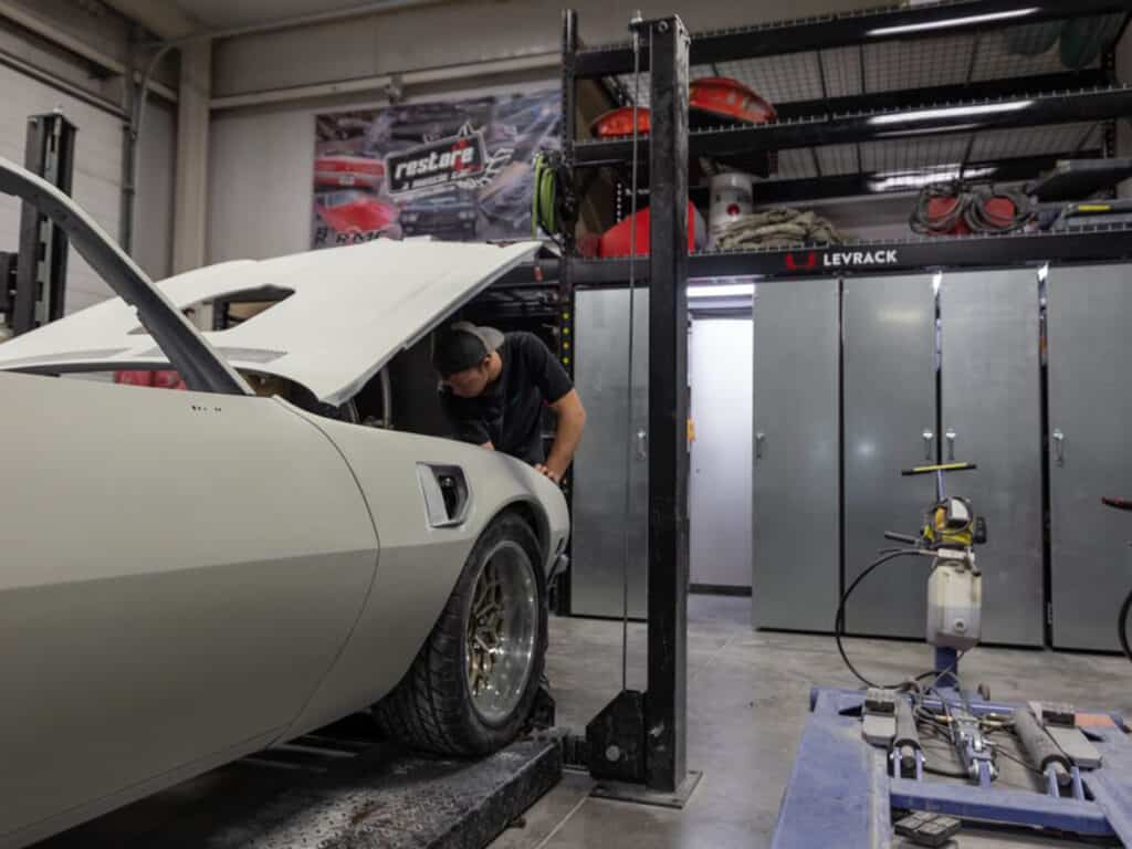 An image of a Levrack shelving system being used in a garage setting.