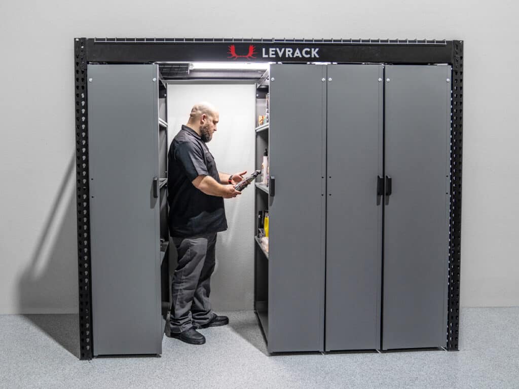 An image of a person using Levrack shelving.
